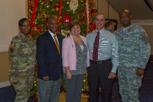 Attending the holiday social in December are Massachusetts National Guard participants (l-r) Lt. Col. Dana Sanders-Udo; 1st Sgt.  Helon Wyllie; Tanya Rioux, state family program director; 1st Sgt. Shane Rioux; and Staff Sgt. Jacques Parent. 