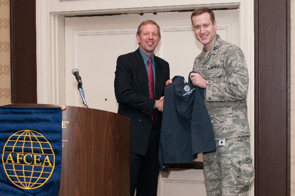 Hardiman recognizes the chapter's AFCEAN of the Quarter for November, Capt. Matt Carroll, USAF, with the presentation of a chapter jacket.