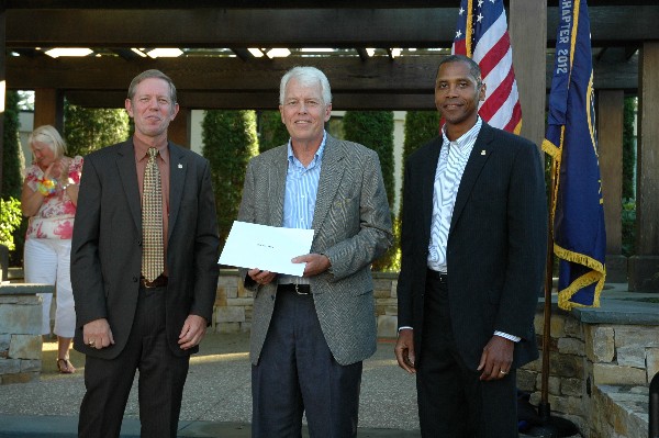 In August, Scott Hardiman (l), chapter president, and Rick Lockridge (r), president, Erie Canal Chapter, present Bob Kennedy, regional vice president, with a gift upon his retirement after 20 years of dedicated service to the region's chapters.
