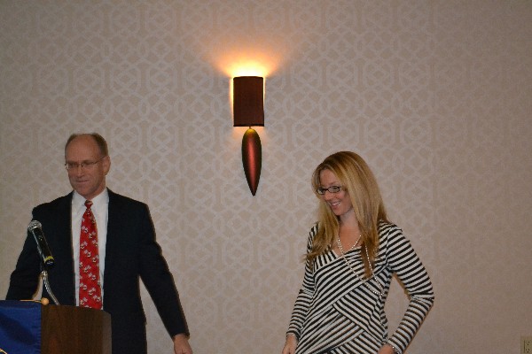 Bud Vazquez (l), chapter president, congratulates Kim Matthews on her selection as the chapter's 2013 Unsung Hero.