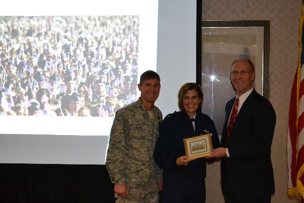 Maj. Gen. Craig Olson, USAF (l), program executive officer for C3I and networks, joins Vazquez (r) in presenting Gen. Crider with a small memento in thanks for her presentation on the Joint Information Environment and its impact on the Air Force at a breakfast meeting in December.