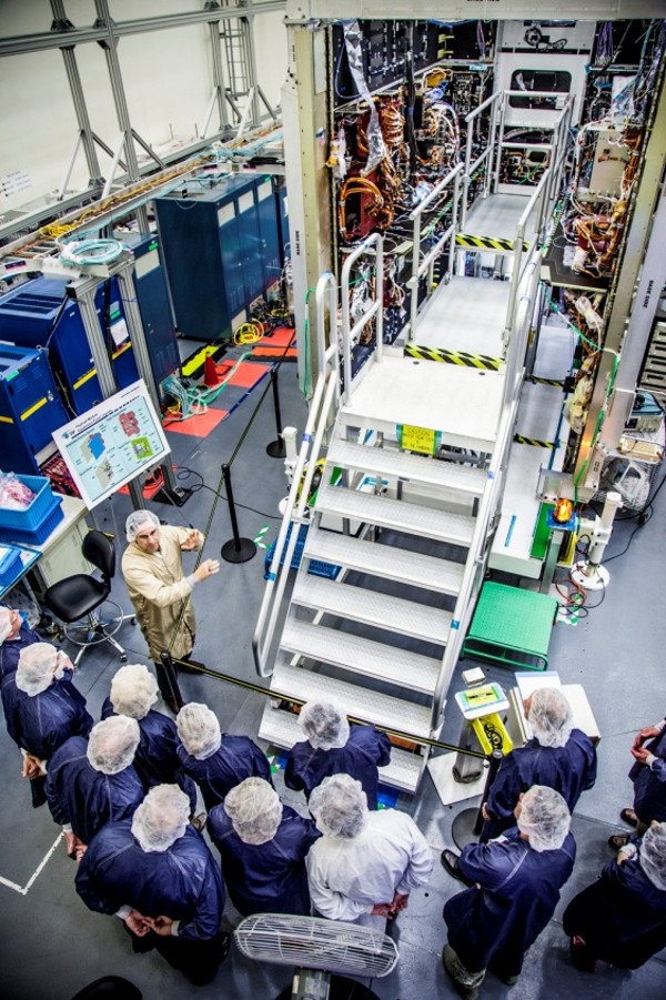 Chapter board members get a close-up look of the anti-jam communications payload for the Advanced Extremely High Frequency (AEHF) satellite at their December board meeting at Northrop Grumman in Redondo Beach, California. (Northrop Grumman photo)