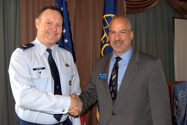 Adam Feingold (r), chapter vice president of programs, thanks Col. Christopher Wegner, USAF, deputy director of contracting, Space and Missile Systems Center, for his presentation at the March luncheon.