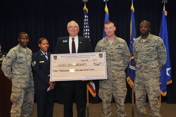 At the Los Angeles Air Force Base Community College of the Air Force graduation ceremony in May, the chapter awards scholarships totaling $3,000 to four airmen. Pictured are (l-r): Senior Airman Levi Mburu, USAF, Staff Sgt. Amanda Holmes, USAF, Chapter President Steve Quilici, 1st Lt. Justin Tullos, USAF, and Staff Sgt. Raymond Ball Jr., USAF.