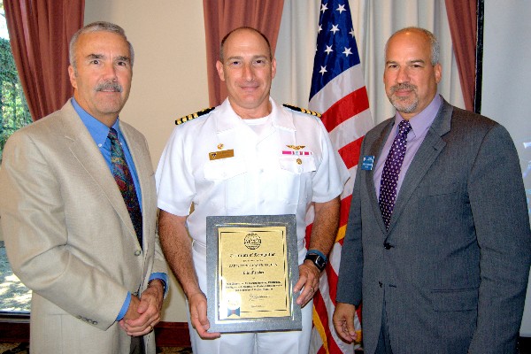 Steve Scott, chapter vice president, membership (l) and Adam Feingold, chapter vice president, programs (r), present a Certificate of Recognition in July to guest speaker Capt. Jeffrey P. Marshall, USN, for his AFCEA lifetime membership. Capt. Marshall is the commanding officer of the Naval Satellite Operations Center, Point Mugu, California.