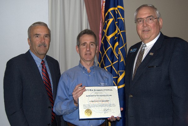 In May, Steve Scott, chapter vice president (l) and Quilici (r) congratulate DC Palter, president of Apposite Technologies, on becoming the newest AFCEA corporate member in the chapter. Apposite provides high-speed, high-precision network emulators to military and commercial clients.