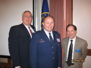 Dr. Steve Quilici, chapter president (l), and Spence Bauer, chapter vice president for programs (r), thank Col. Philip Simonsen, USAF, Air Force Space and Missile Systems Center, for his presentation at the chapter's March meeting.