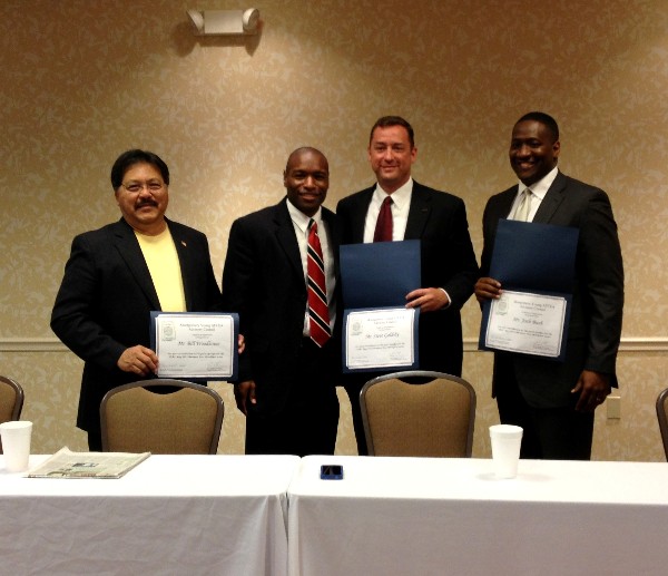 At the May meeting, Eric Sloan (2nd from l), president of the chapter's Young AFCEAN Advisory Council, presents certificates of appreciation to guest speakers Bill Woodhouse (l), chief executive officer (CEO), eSolution Architects, Incorporated; Steve Goldsby (2nd from r), CEO, Integrated Computer Solutions; and Josh Bush, CEO, Up and Running Incorporated.