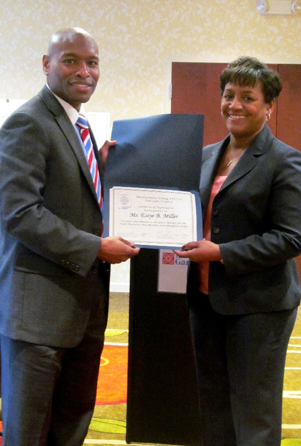 Eric Sloan (l), president of the chapter's Young AFCEANs, presents a certificate of appreciation to Essye Miller for her dynamic presentation at the December Business Over Breakfast event.