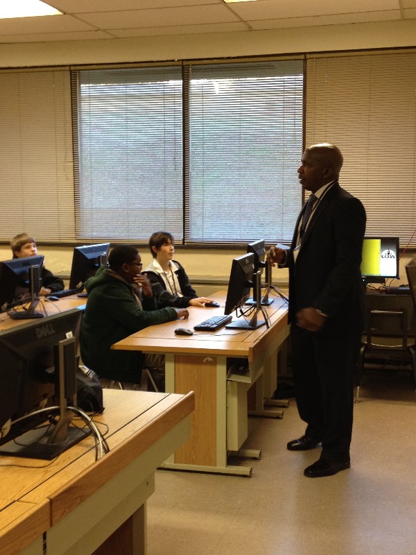 Ahmad Austin, chapter member, conducts a mini-camp session in February by presenting an overview on cybersecurity and its increasingly prevalent role in todays society.
