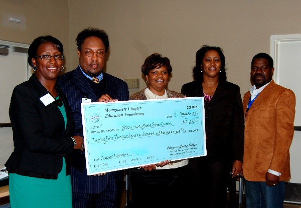 In November, Charisse Stokes (l), director, chapter Education Foundation, presents Dr. Melvin Lowe (2 from l), Dr. Jacqueline Brooks (2 from r), a school board member (c) and Christopher Clark, a Career and Tech Center instructor (r), with a Chapter Initiative Grant valued at more than $20,000.