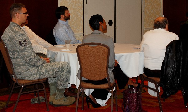 In March, Business Over Breakfast attendees listen attentively to a presentation from Col. Ted Lowry, USAF (Ret.), on