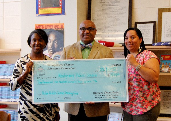 Charisse Stokes (l), director, chapter Education Foundation, presents Patrick Nelson (c), principal, McKee Middle School, and Monica Jackson, science instructor and seventh grade Science Department chair, with a Science Teaching Tools Award in October.