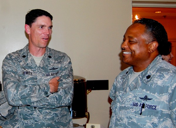 Lt. Col. James Hewitt, USAF (l), commander, 26th Network Operations Squadron, and Lt. Col. Leonard Boothe, USAF, chapter vice president, share a laugh and converse during the welcome reception event in September.