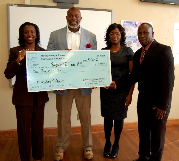 Charisse Stokes, director of the chapter’s Education Foundation, presents Lorenza Pharrams and the IT Academy with a $1,000 Science Teaching Tools Grant in October.