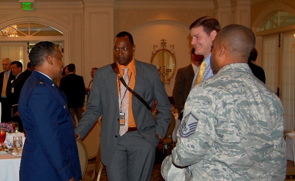 Representatives from industry and military mingle after the April luncheon. Companies who helped sponsor the event were: Array, Telos, Unisys, The Centech Group, Disruptive Technologies, IBM and General Dynamics.