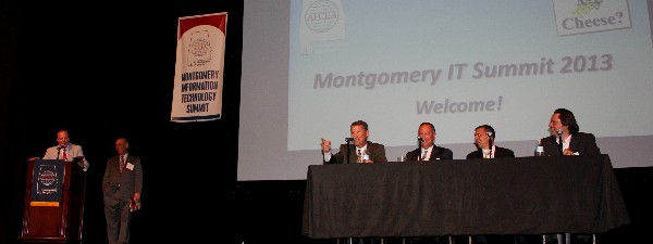 Bill Marion (seated l), chief technology officer, Air Force Space Command, answers a question during the mobile computing panel discussion in June. Other panel members include (seated, 2nd from l to r) Henry Torres, Brocade Communications Federal Sales, U.S. Air Force and National Guard; Michael Zirkle, associate director of public sector solutions and marketing, Verizon Enterprise Solutions; and Dave Meeker, Roundarch Isobar vice president. Joe Besselman (standing l), chapter president, and Bob Frye, panel moderator, react to Marion’s comments.