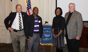 Dr. Joe Besselman (l), chapter president, and Tom Gwaltney (r), regional vice president, join the chapter in honoring Eric Sloan and Kameke Mitchell, winners of the 2011 Distinguished Young AFCEAN Award and 2011 Emerging Leadership Award, respectively.