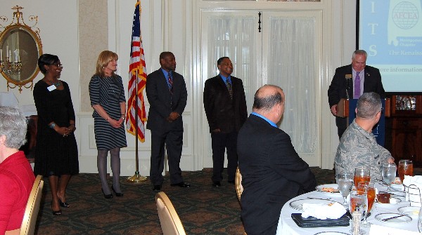 Tom Gwaltney (r), regional vice president, inducts new members of the chapter’s board of directors in February.