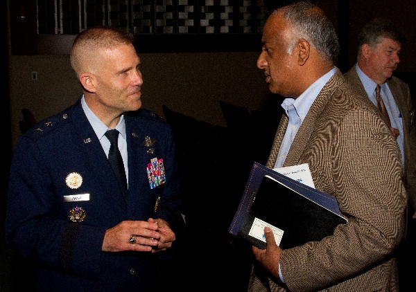 Maj. Gen. Steven Kwast, USAF, commander, Curtis E. Lemay Center for Doctrine Development and Education and vice commander, Air University (l), networks with an attendee after his presentation during MITS 2014 in May.