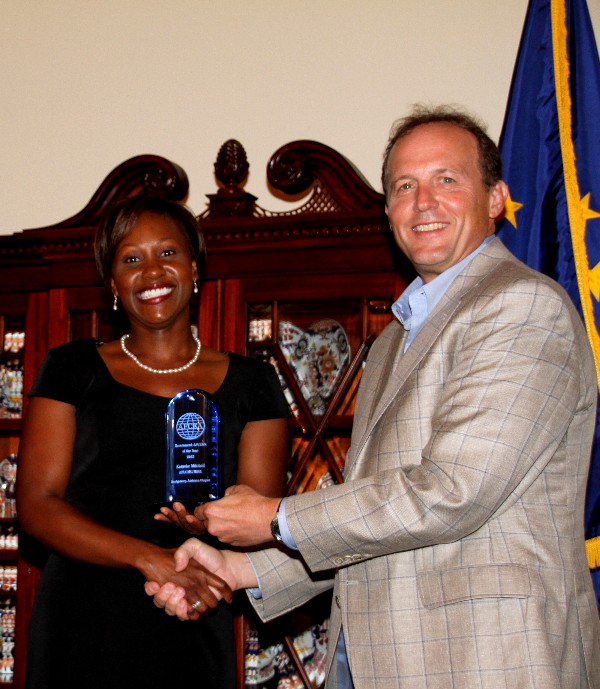 Mitchell, the AFCEA International Young AFCEAN of the Year, accepts her award from Besselman in August.