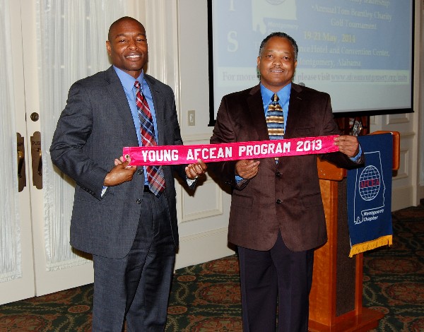 In February, Eric Sloan (l), chapter vice president, and Lt. Col. Leonard Boothe, USAF (r), chapter president, proudly display the chapter’s Model Young AFCEAN Program ribbon.