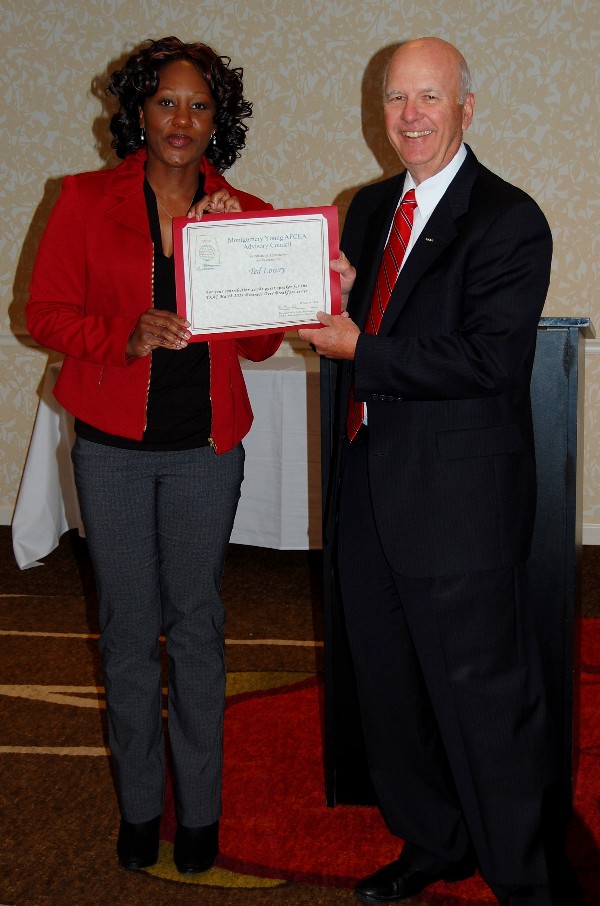 Kameke Mitchell (l), president of the chapter's Young AFCEAN Advisory Council, presents Col. Lowry with a certificate of appreciation for speaking at the Business Over Breakfast in March.