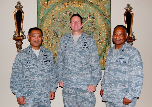 From l-r, Col. Jobo, Col. Jiru (c) and Lt. Col. Leonard Boothe, USAF, chapter president, take a break from networking with welcome reception attendees in September to smile for the camera.
