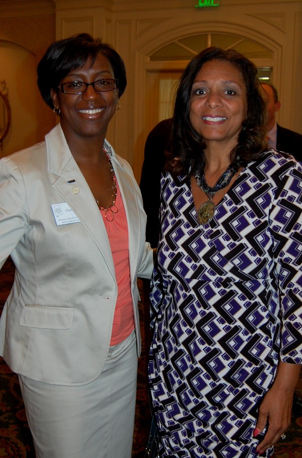 Charisse Stokes, director of the chapter’s Education Foundation, and Deb Foster take a minute to greet each other after the presentation in April.
