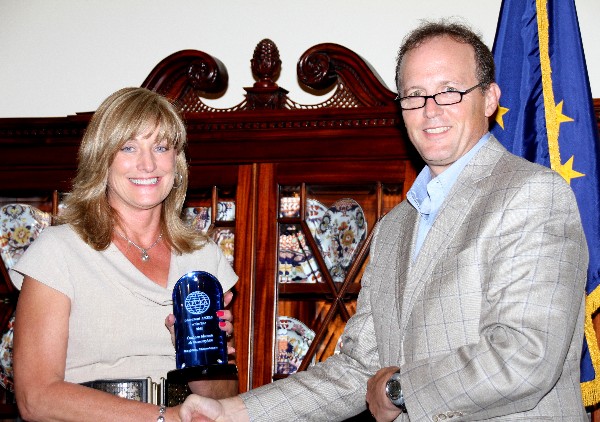 At the August awards event, Akerson, recipient of the AFCEA International Meritorious Service Award for Distinguished Service to Education, accepts her award from Besselman.