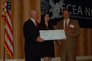 The chapter recognizes a scholarship winner during an awards dinner.