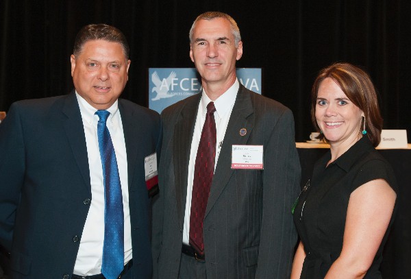 Sam Jones (l), chapter president, and Richard Spires, chief information officer, U.S. Department of Homeland Security, present the chapter's May Young AFCEAN Award to Amy Earnest, a business development associate for NOVA Corporation.