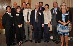 Bill Stewart (5th from r), chapter president, joins scholarship committee members and Northern Virginia Community College Pathway Scholarship recipients at the September luncheon.