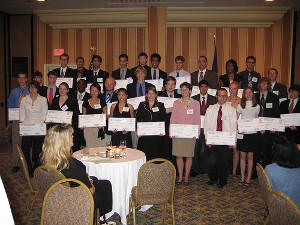 The scholarship winners receive their awards after the dinner. The chapter's annual scholarship dinner was held in July.  