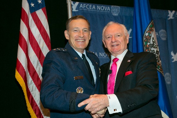 Keynote speaker Lt. Gen. Michael J. Basla, USAF, and Chuck Corjay, event lead, gather for the 12th Annual Air Force IT Day in December.