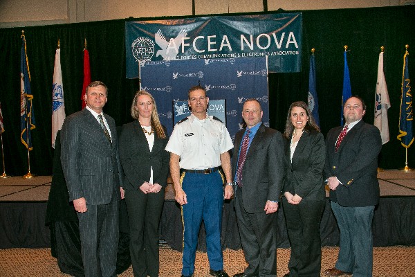Together at the March luncheon are (l-r) Ron Zich, chapter president; Fiona Wass, Deltek; Col. Ken Blakely, USA, guest speaker and commander, Command and Control Support Agency; Tim Patch, Sagent Partners; Cara Odlen, ANU Professional Training; and Dave Fraley, Paragone Solutions.