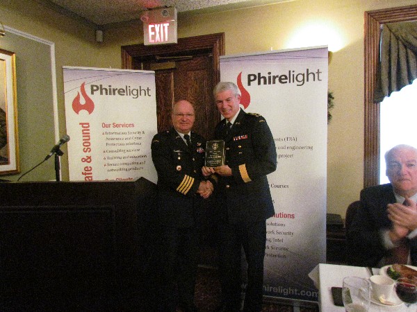 Col. Martin Girard, Canadian Armed Forces (l), chapter president, presents a token of appreciation to the December luncheon speaker Lt. Gen. Guy R. Thibault, Canadian Armed Forces, vice chief of the Defense Staff.