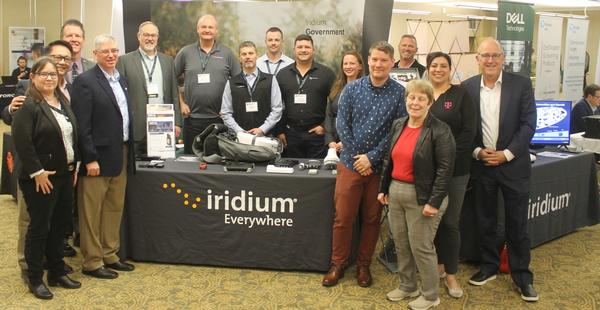 In February, chapters officers pose with event sponsor, Iridium. 