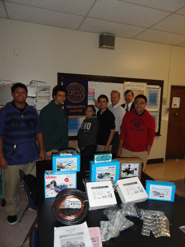 Together at the AFCEA STEM grant presentation in November are (l-r) Woodrow Wilson High School students Josue Soto, Roberto Santiago, Amber Camacho and Alfredo Llorens; Dave Purdon, science teacher, Woodrow Wilson High School, recipient of the 2013 AFCEA STEM grant; Tom Rachfalski, chapter president; and student Jason Roman.