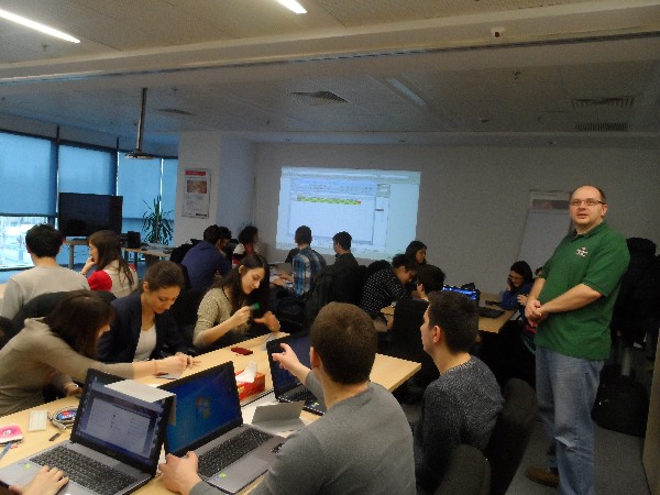 Lecturer Horia Boicu, CAE leader, Microchip Technology Romani (r) with students from the Faculty of Electronics, Telecommunications and Information Technology during a practical session in July.