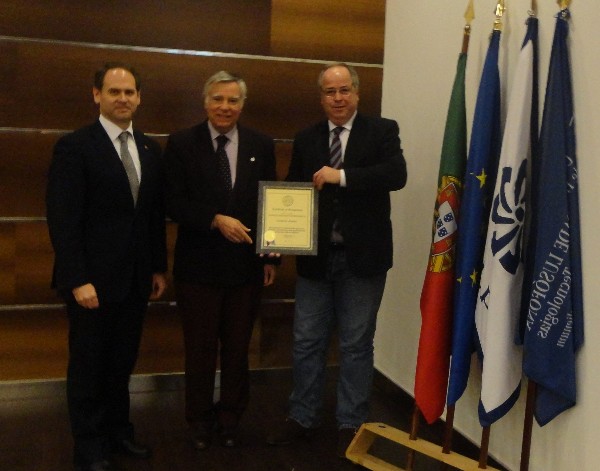 Rear Adm. Carlos Rodolfo, PRT (Ret.) (c), chapter president, presents professor Sergio Vieira da Silva (r), Ph.D., director of the Bachelor of Science in Security Studies at Universidade Lusofona, with a corporate membership certificate in December recognizing ENSINUS - Estudos Superiores S.A. (ISG) as member of AFCEA in the presence of professor Vasco Martins dos Santos.