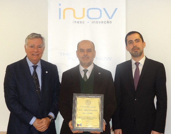 In May, Rear Adm. Carlos Rodolfo, PON (Ret.) (l), chapter president, presents Fernando Moreira (c), president of the board of INOV Inesc - Inovacao, with a corporate membership certificate in the presence of John Rodrigues, business development director for Defense and Security.