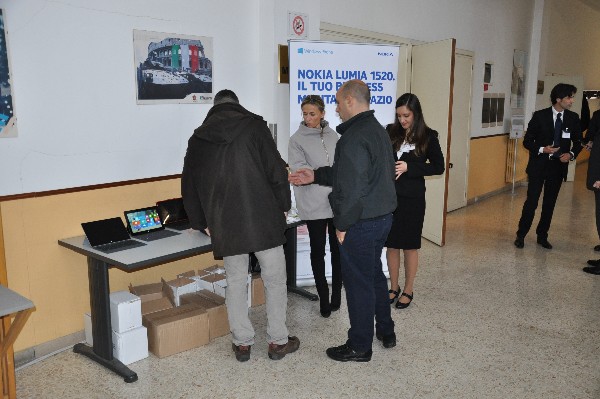 Attendees visit one of the exhibition desks in the homeroom lobby at the chapter’s January workshop on mobile applications.