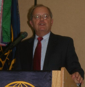 Dennis Bauman, Joint Tactical Radio System, delivers his address at the January luncheon, where he discussed the defense contractor acquisition process.