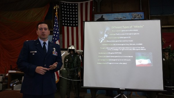 Lt. Col. Enrique Oti, USAF, Stanford University fellow, discusses the different types of cyberattacks at a May meeting.