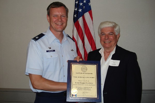 Morehead presents an award to Lt. Col. Douglas Lomsdalen, USAF, in August for his efforts within the chapter to streamline chapter communications and event registration.