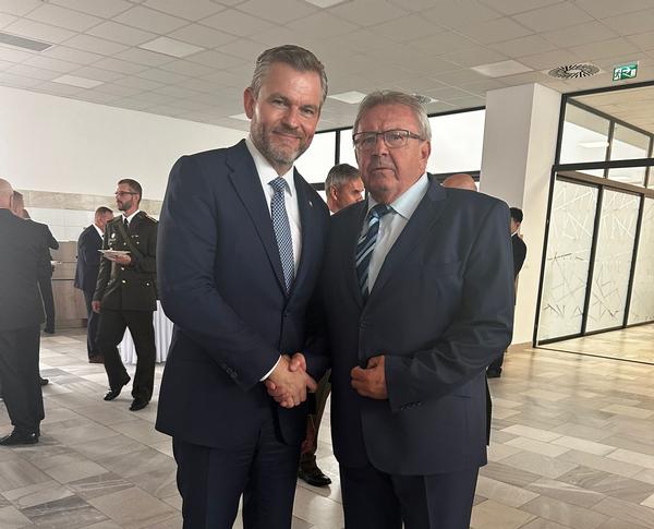 H.E. Peter Pellegrini, president of the Slovak Republic (l), stands with Col. Ladislav Kollarik (Ret.), chapter vice president, in June.