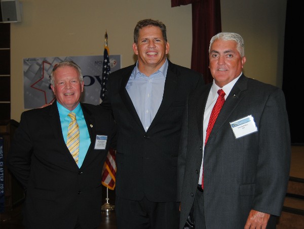 Capt. Gerry Slevin, USN (Ret.) (l), chapter first vice president, joins guest speaker James “Hondo” Geurts (c), acquisition executive, U.S. Special Operations Command, and Manning Bolchoz at the July chapter meeting.