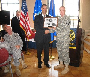 Marion (l) recognizes Master Sgt. Paul Kammerman, USAF, 10th Intelligence Squadron, as Airman of the Month for November.