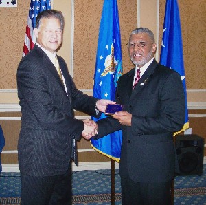 At the April meeting, Richardson (l) recognizes Allen as the March AFCEAN of the Month.
